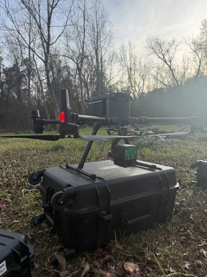 DJI Matrice 350 RTK survey drone with a Zenmuse L2 LiDAR sensor, staged on its case at a jobsite